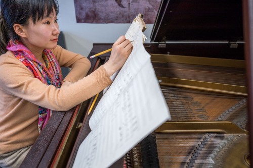 Wang Lu, composer and pianist and associate professor of music, says each piece begins like a cultural research project.