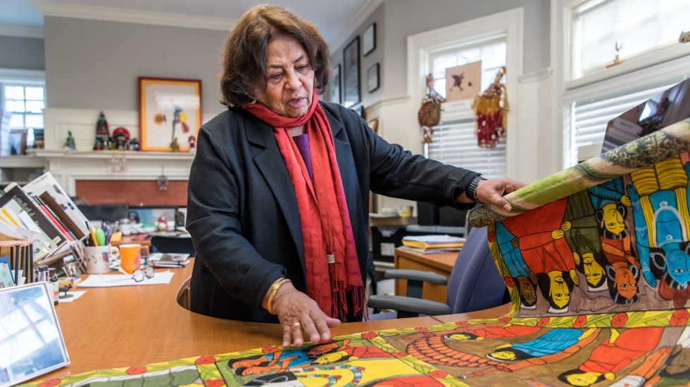 Fruzzetti displays a scroll in her office.